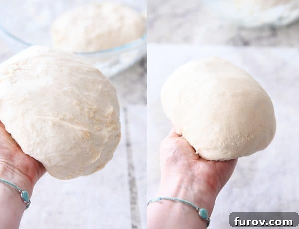 Hands carefully shaping rustic crusty bread dough into a rounded loaf on a countertop.