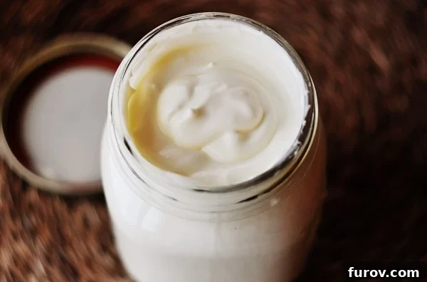 Make Your Own Crème Fraiche and Caprese Focaccia 2 A glass mason jar filled with freshly made, creamy homemade crème fraîche.