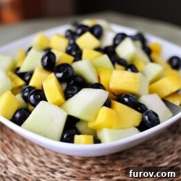 Small recipe image of the honeydew, blueberry, and mango salad.
