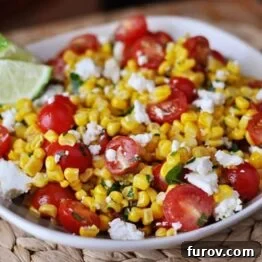 Mexican Tomato and Corn Salad with lime wedges