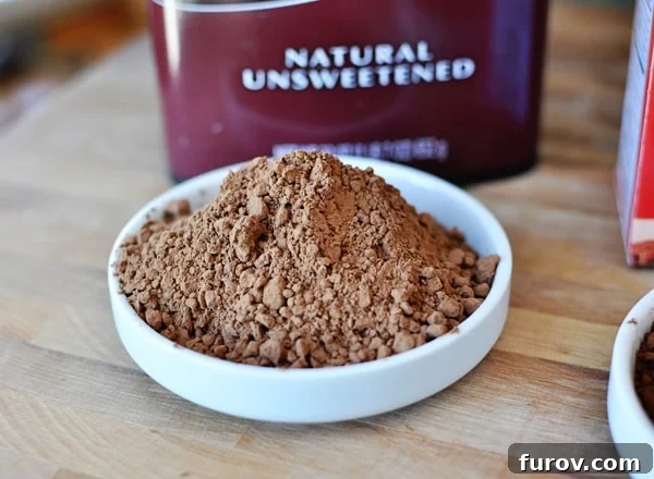 Hersheys natural unsweetened cocoa scooped into a white bowl