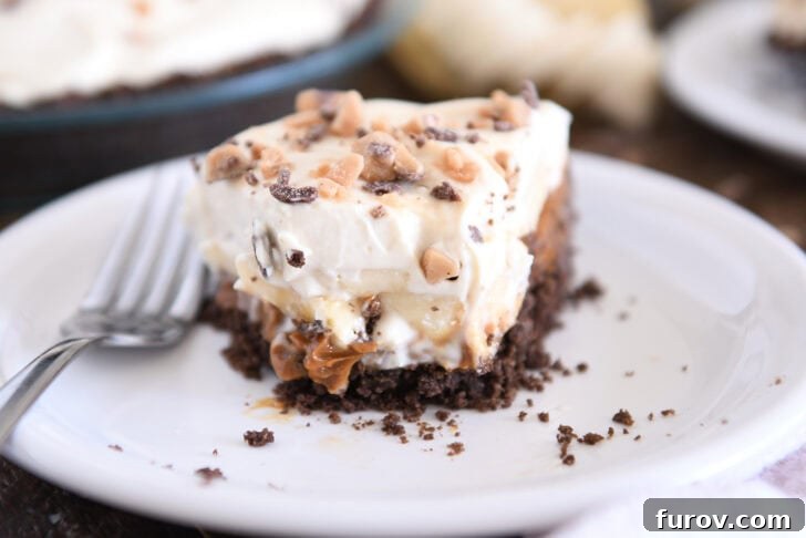 Another tempting view of a slice of Banoffee Pie, emphasizing the generous layers and the appealing texture of each component, inviting a closer look.