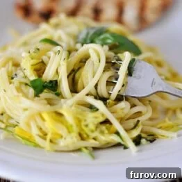 A simple yet elegant bowl of Zucchini & Yellow Squash Spaghetti, ready to be served.