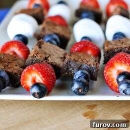 Brownie & Fruit Kebabs on a white platter