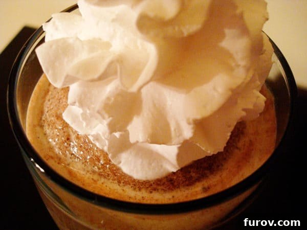 Top view of whipped cream topped frozen hot chocolate, garnished with chocolate shavings.