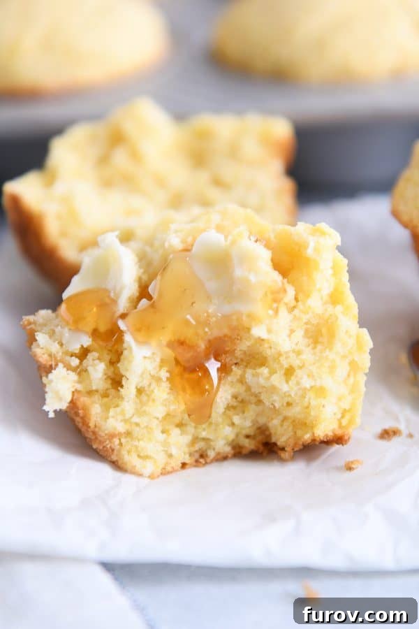 The best cornbread muffins split in half with butter and honey.
