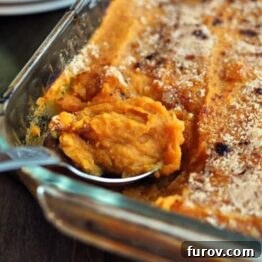 Sweet Potato Casserole in a dish with a golden, bubbly topping.
