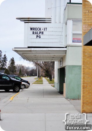 A classic, small-town movie theater marquee displaying a single film title, capturing the charm of local entertainment