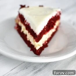 Decadent Red Velvet Cheesecake 5 Red Velvet Cheesecake Cake with a slice removed