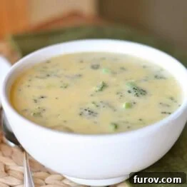 A charming image of homemade broccoli cheese soup in a bowl.