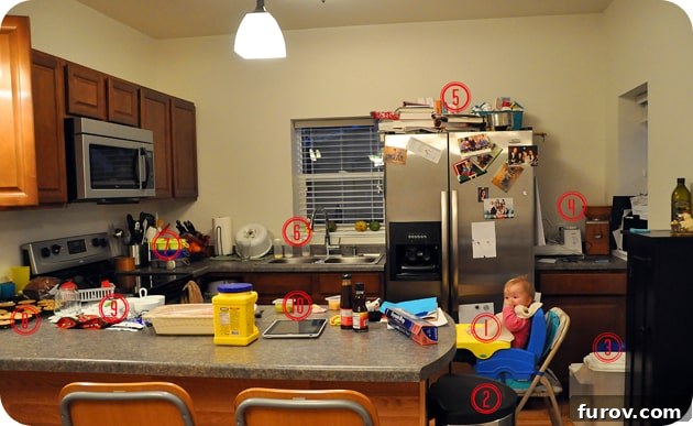 Snapshot Saturday: Life Unposed 3 A dynamic shot of a busy kitchen, showing a sink full of bottles and various cooking items on the counter.