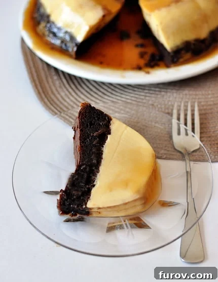 The Impossible Cake 4 A large Chocolate Flan Cake on a serving platter with a slice removed, revealing the perfect layers.