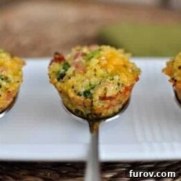 A close-up of a cooked cheesy ham and broccoli quinoa bite, golden and inviting.