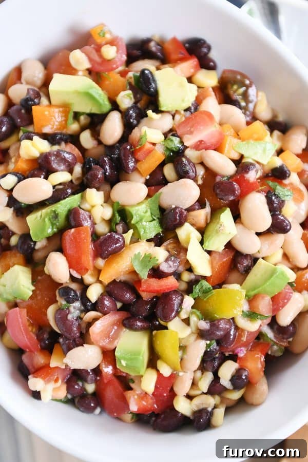 Zesty Cowboy Caviar Explosion 4 Top-down view of the vibrant cowboy caviar dip in a white bowl, highlighting the fresh ingredients and inviting colors.