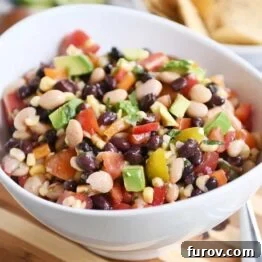 Zesty Cowboy Caviar Explosion 6 Cowboy caviar dip in white bowl.