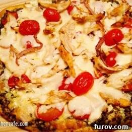 Pesto Pizza with Pine Nuts and Feta, showing a close-up of the delicious toppings.