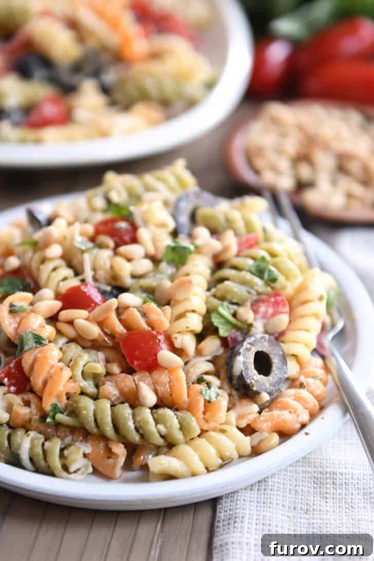 Vibrant Tricolor Pasta Medley 7 Serving of pasta salad on gray plate.