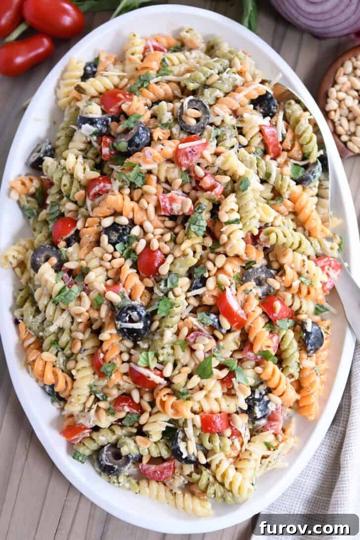 Vibrant Tricolor Pasta Medley 8 Top down view of colorful tri-color pasta salad on oval white platter.