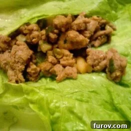 Delicious ground turkey in a crisp lettuce leaf, ready to be wrapped.