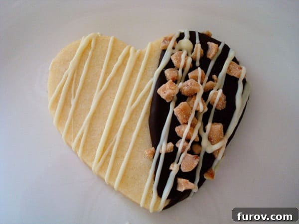 Chewy Chocolate Toffee Treasures 5 A single heart-shaped sugar cookie elegantly drizzled with white chocolate.