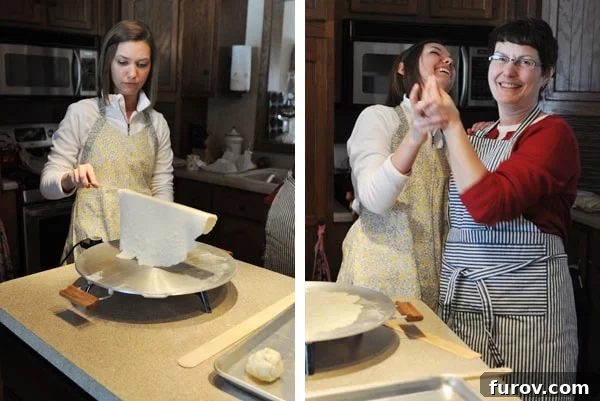 A person rolling out lefse dough with a traditional grooved rolling pin on a floured surface.