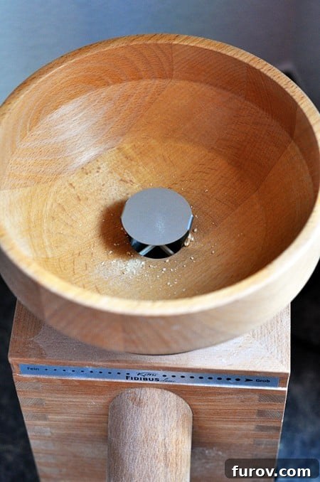 The Essential Guide to Wheat Grinders: 60+ Top Models Reviewed 3 Top view of the hopper of a wheat grinder, ready for wheat berries.