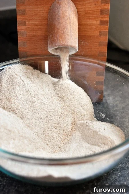 The Essential Guide to Wheat Grinders: 60+ Top Models Reviewed 7 A bowl overflowing with fluffy, freshly ground wheat flour, ready for baking.