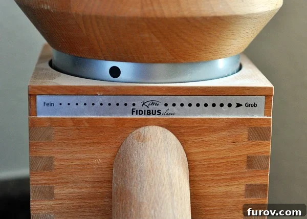 The Essential Guide to Wheat Grinders: 60+ Top Models Reviewed 8 Front view of a wheat grinder, highlighting its adjustable setting for flour texture.