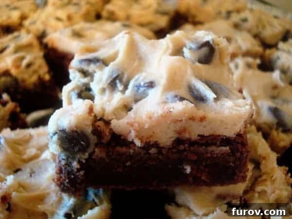 Ultimate Cookie Dough Brownies 2 Fudgy brownies generously topped with a creamy, delectable cookie dough frosting, sprinkled with chocolate chips.