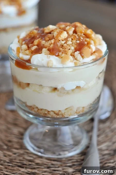 A small banana caramel pudding trifle with drizzled caramel on top.