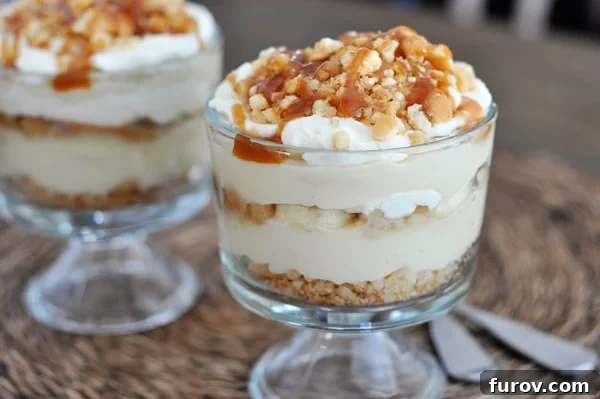 Two mini banana pudding caramel trifles drizzled with caramel.