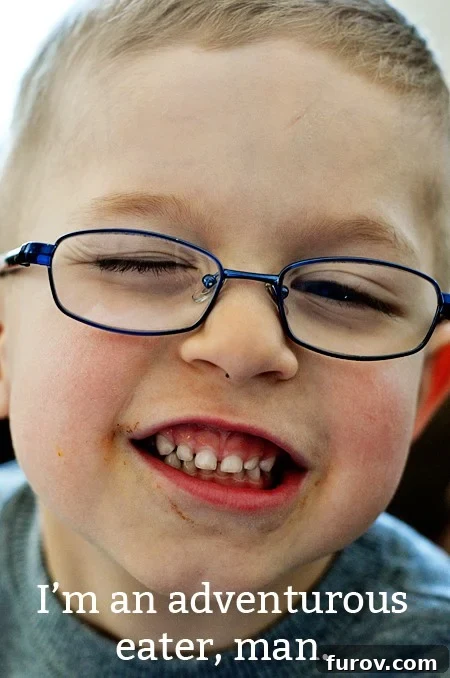 10 Ways to Inspire Little Food Adventurers 3 a little boy with glasses with a big smile on his face