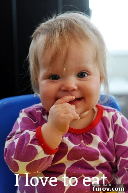 10 Ways to Inspire Little Food Adventurers 5 a baby girl eating with food on her face