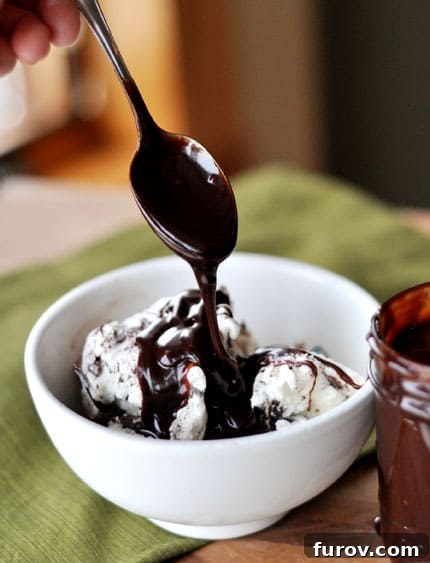 Velvety Hot Fudge Sauce 2 Decadent homemade hot fudge sauce drizzled over vanilla ice cream with a spoon