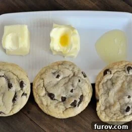 A stack of perfectly baked chocolate chip cookies, golden brown with visible melted chocolate, against a warm, inviting background.