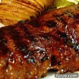 Succulent Steak and Hasselback Potatoes served on a plate