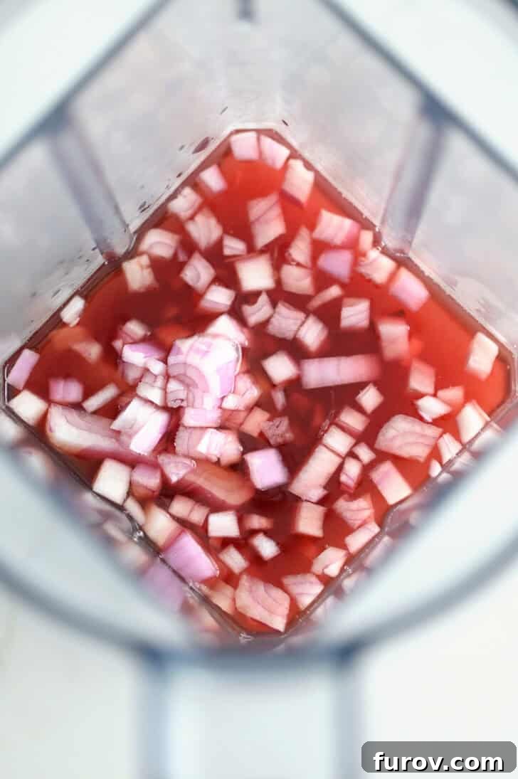 Zesty Chopped Taco Salad with Homemade Catalina 5 Top down view of blender with onions, red wine vinegar and olive oil, before blending.