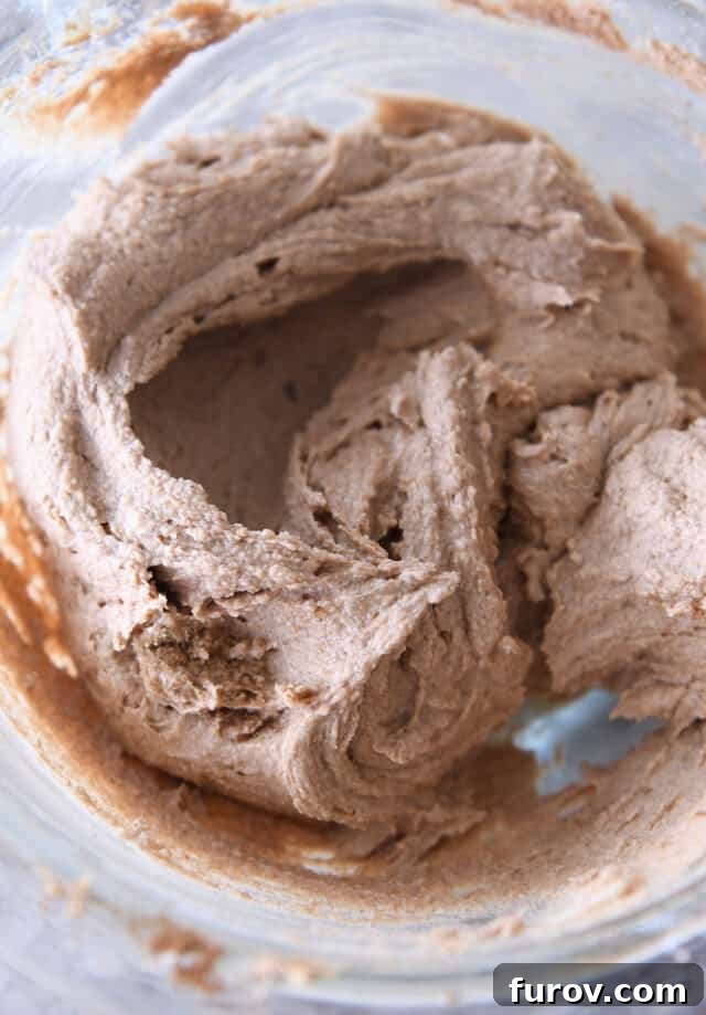 Cinnamon, butter and sugar in glass bowl.