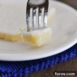 White Texas Sheet Cake with a fork taking a bite out