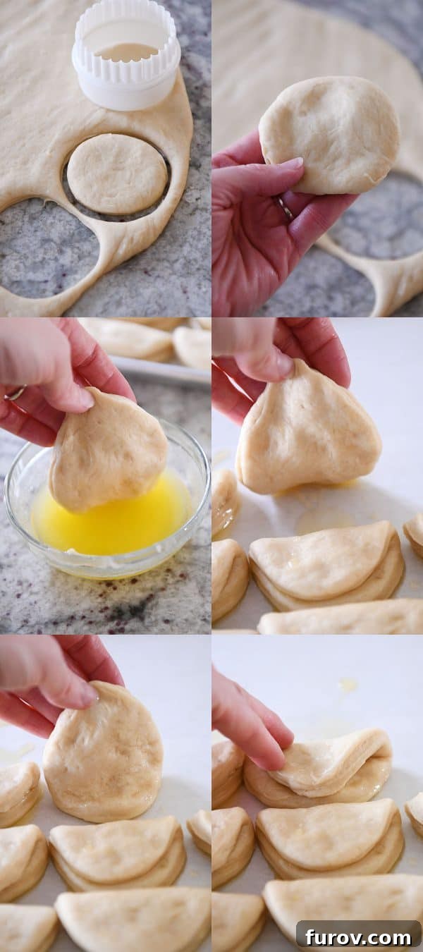 Cloud-Soft Parker House Rolls 4 Dipping Parker house rolls in butter and putting them on the sheet pan.