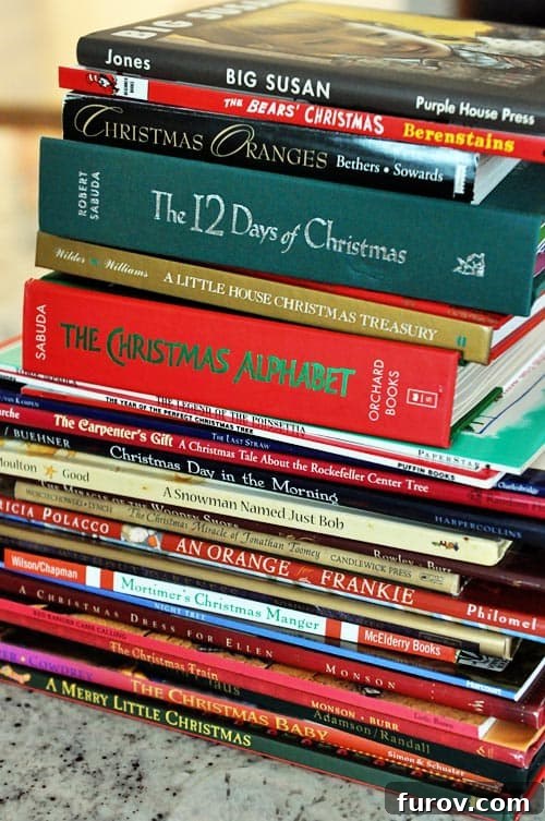 Our Beloved Holiday Rituals Captured This Weekend 6 A beautifully arranged stack of various Christmas-themed books, wrapped in festive paper, ready for reading.