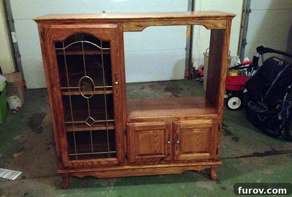 The entertainment center transformed into a play kitchen in the garage