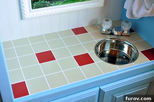 Close-up of the DIY play kitchen countertop, showing the painted tile effect