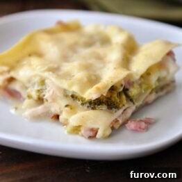 A perfectly portioned square of Chicken Cordon Bleu Lasagna, ready to be enjoyed.
