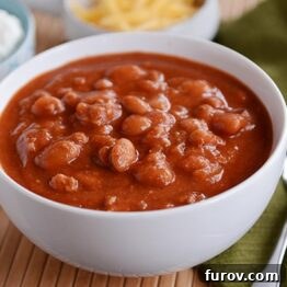 A bowl of My Mom's Classic Chili, garnished and ready to serve.