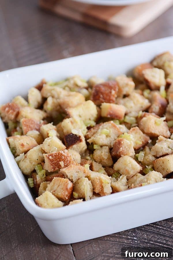 White ceramic dish with homemade Thanksgiving stuffing, ready to be served.