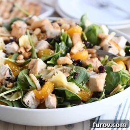 Bowtie pasta salad with teriyaki dressing in large white bowl.