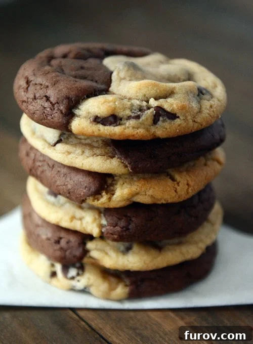 Double Delight Brownie Cookies 5 A stack of half brownie, half chocolate chip cookie cookies.