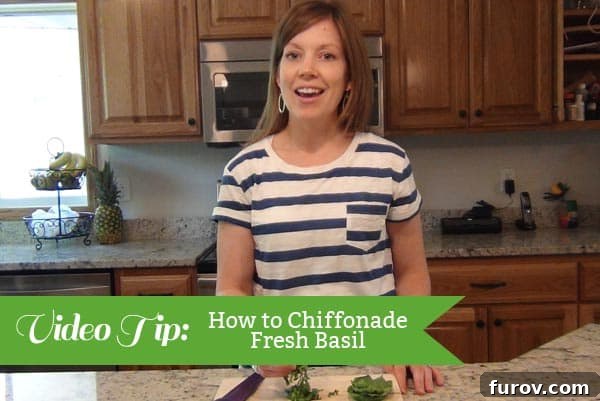 Learn to Chiffonade Basil Simple Skill for Every Cook 2 A woman standing in a kitchen with the text: How to Chiffonade Basil on the picture.