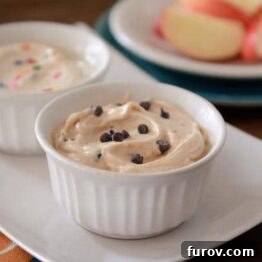 A close-up shot of the Cookie Dough and Funfetti Greek Yogurt Dips side by side, garnished with their respective toppings.